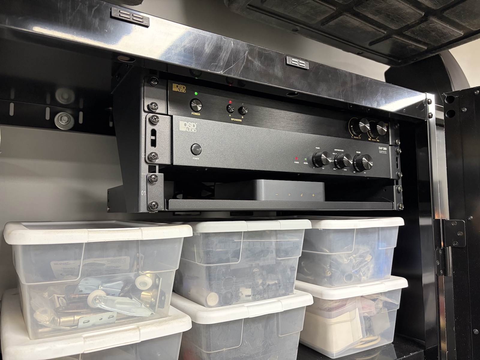 Garage audio system with rack-mounted equipment installed inside a storage cabinet in Miller Place, NY