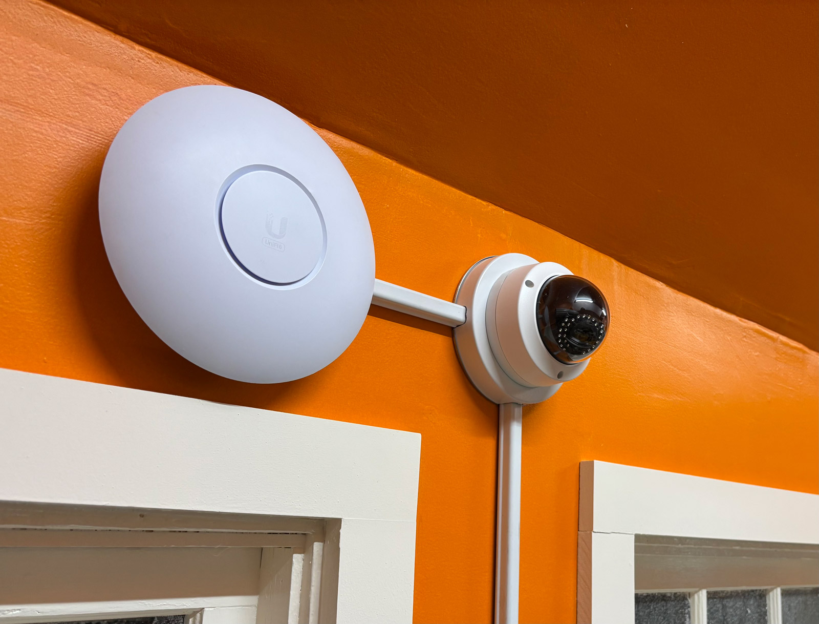 Wi-Fi access point and camera installed with 500 surface raceway at a coffee shop in Suffolk County.