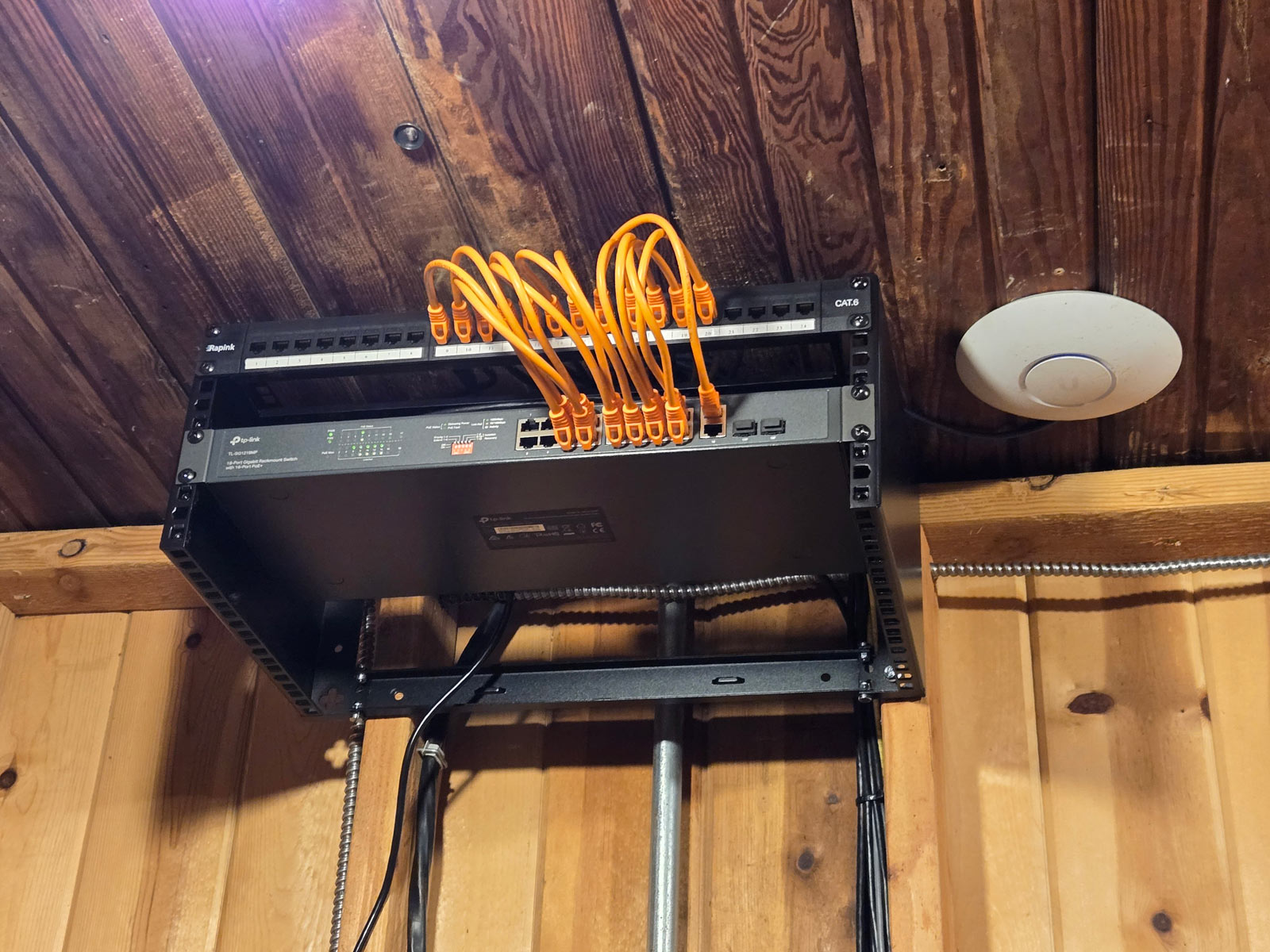 Small IT network rack installed in a winery replacing wall-mounted switches.